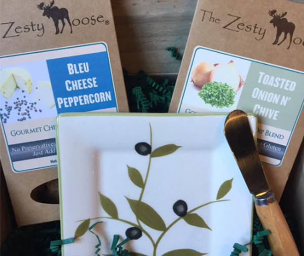 <b>Cheese Ball Gift Set:</b> Set includes a beautiful cheese ball plate, metal and bamboo cheese spreader, our Bleu Cheese Peppercorn and Toasted Onion Cheese Ball / Dip Blends.