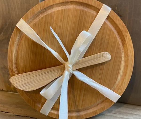 <b>Bamboo Cheese Board & Spreader:</b> Enjoy your finest cheese in gourmet style with this fantastic eco-friendly bamboo cheese board and spreader. The board provides a generous space for cutting and serving premium cheese selections. Board measures approx. 5.5" in diameter.